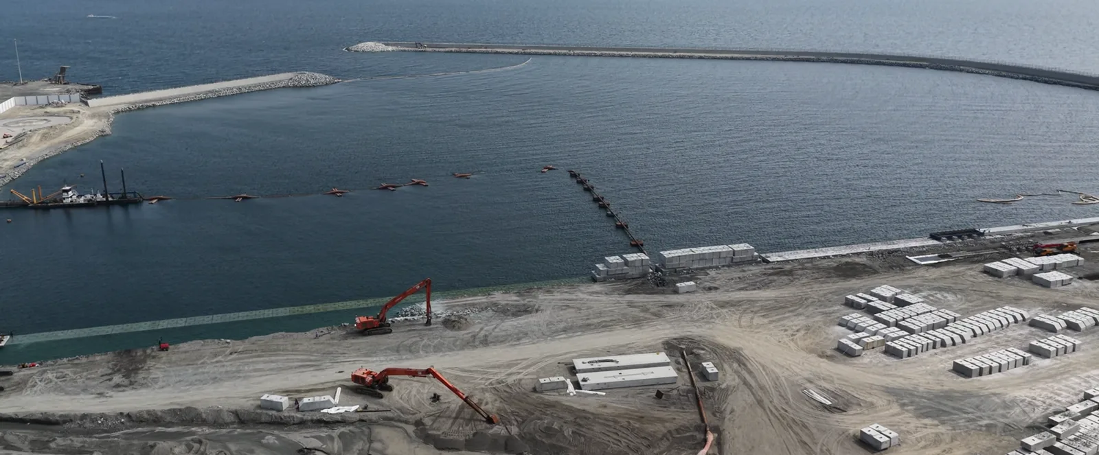 Al Rughaylat Port — quay wall construction and precast-block storage