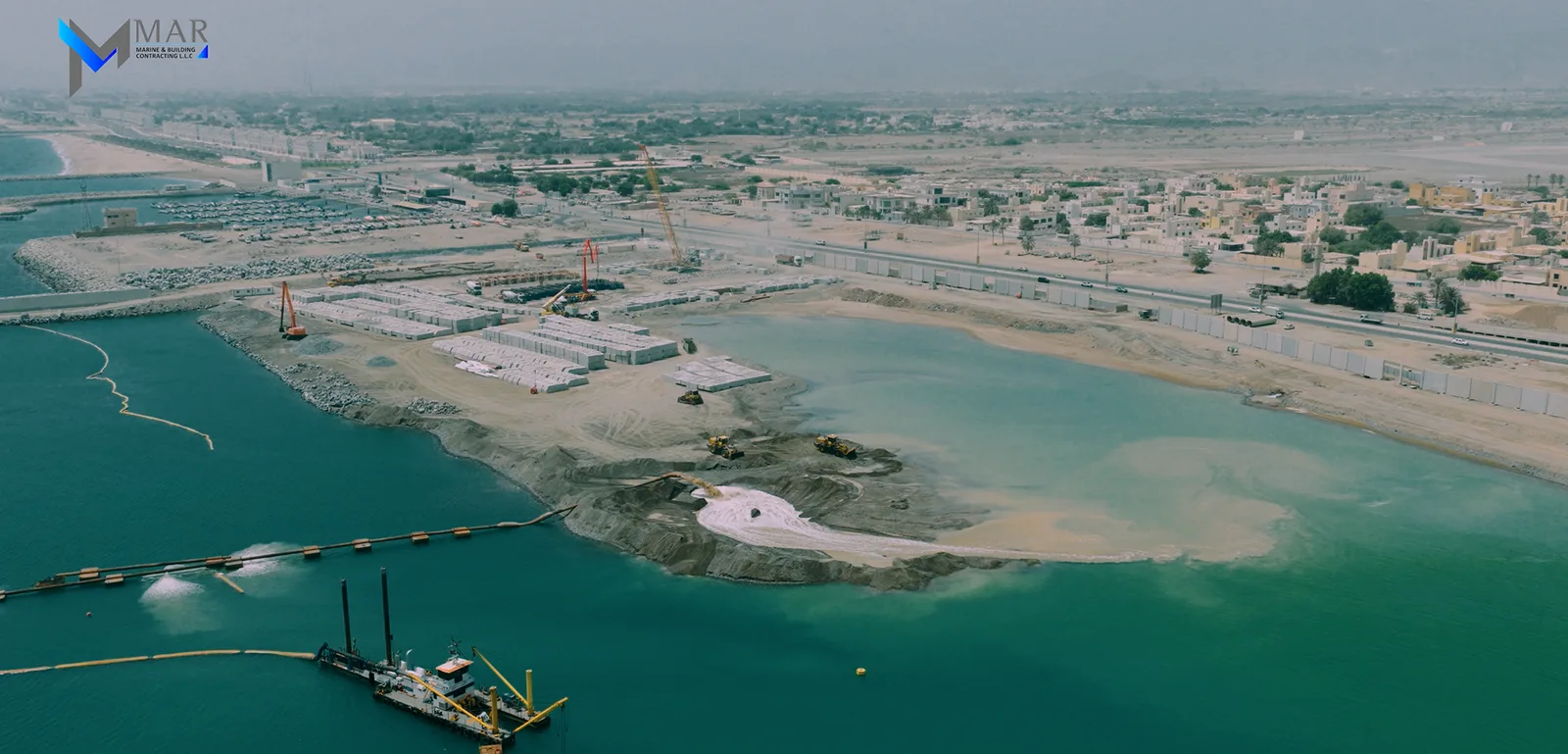 Al Rughaylat Port — aerial view of marine and landside construction
