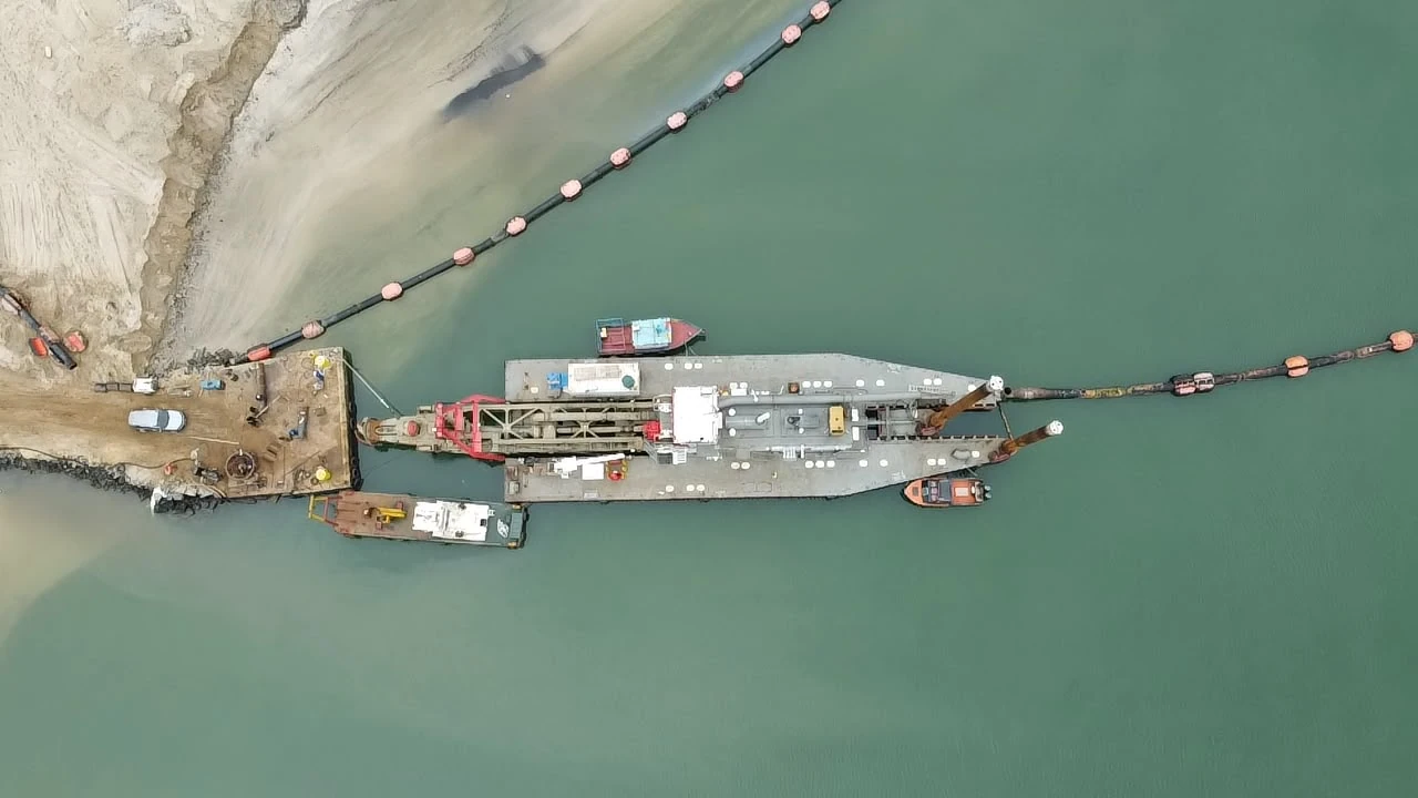 Overhead view of the dredger and floating pipeline
