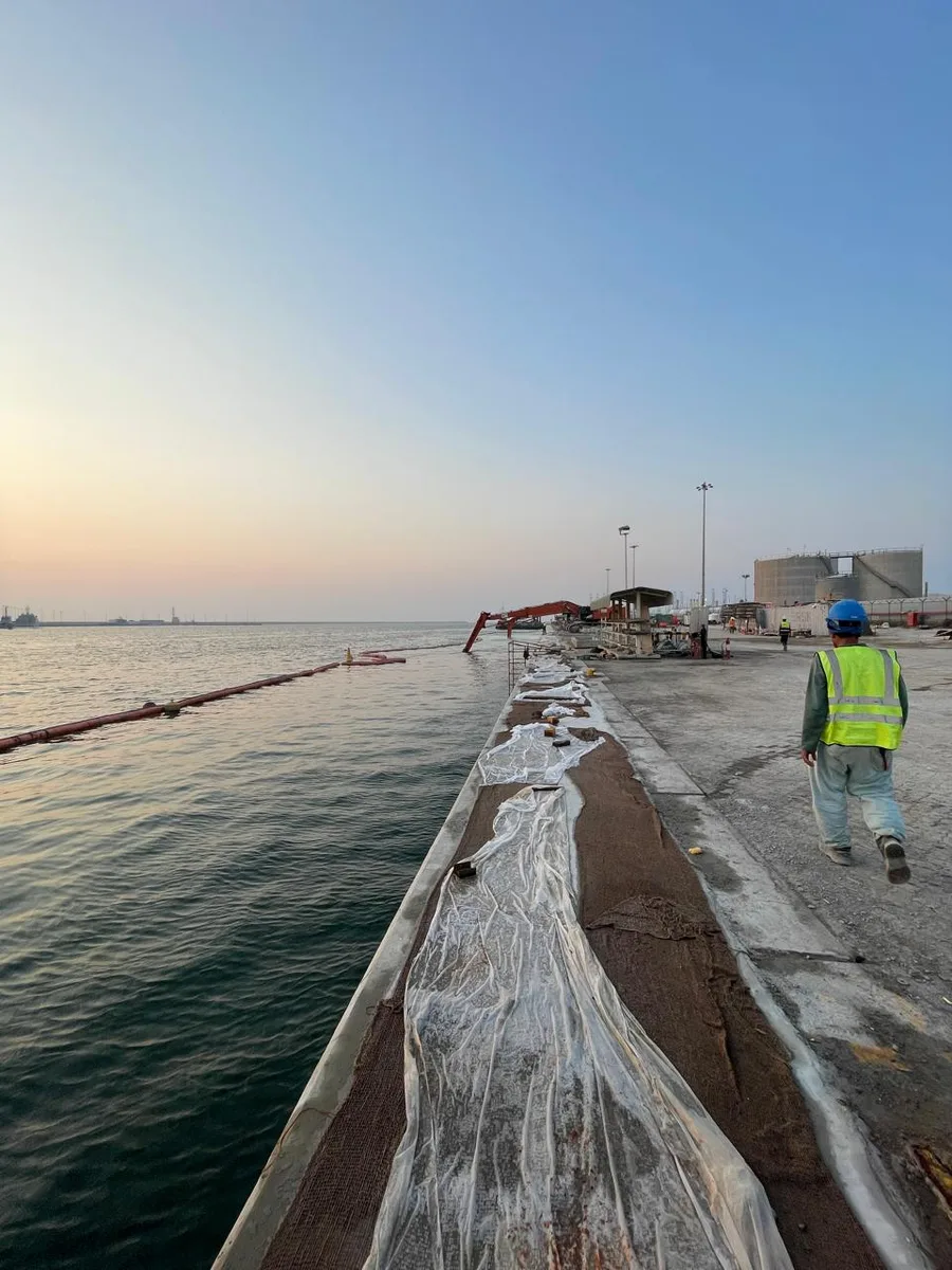 East Wharf, Jebel Ali — concrete curing along the capping beam