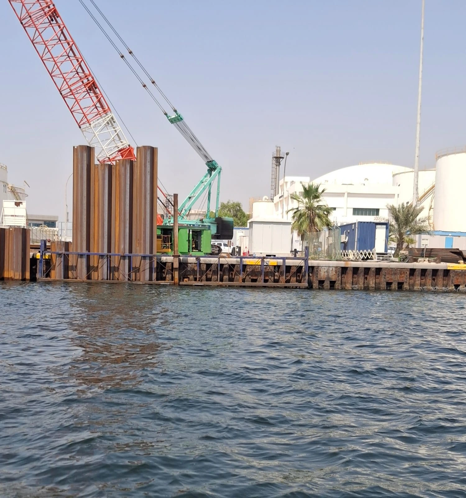 East Wharf, Jebel Ali — sheet-pile works and crane operations viewed from the water
