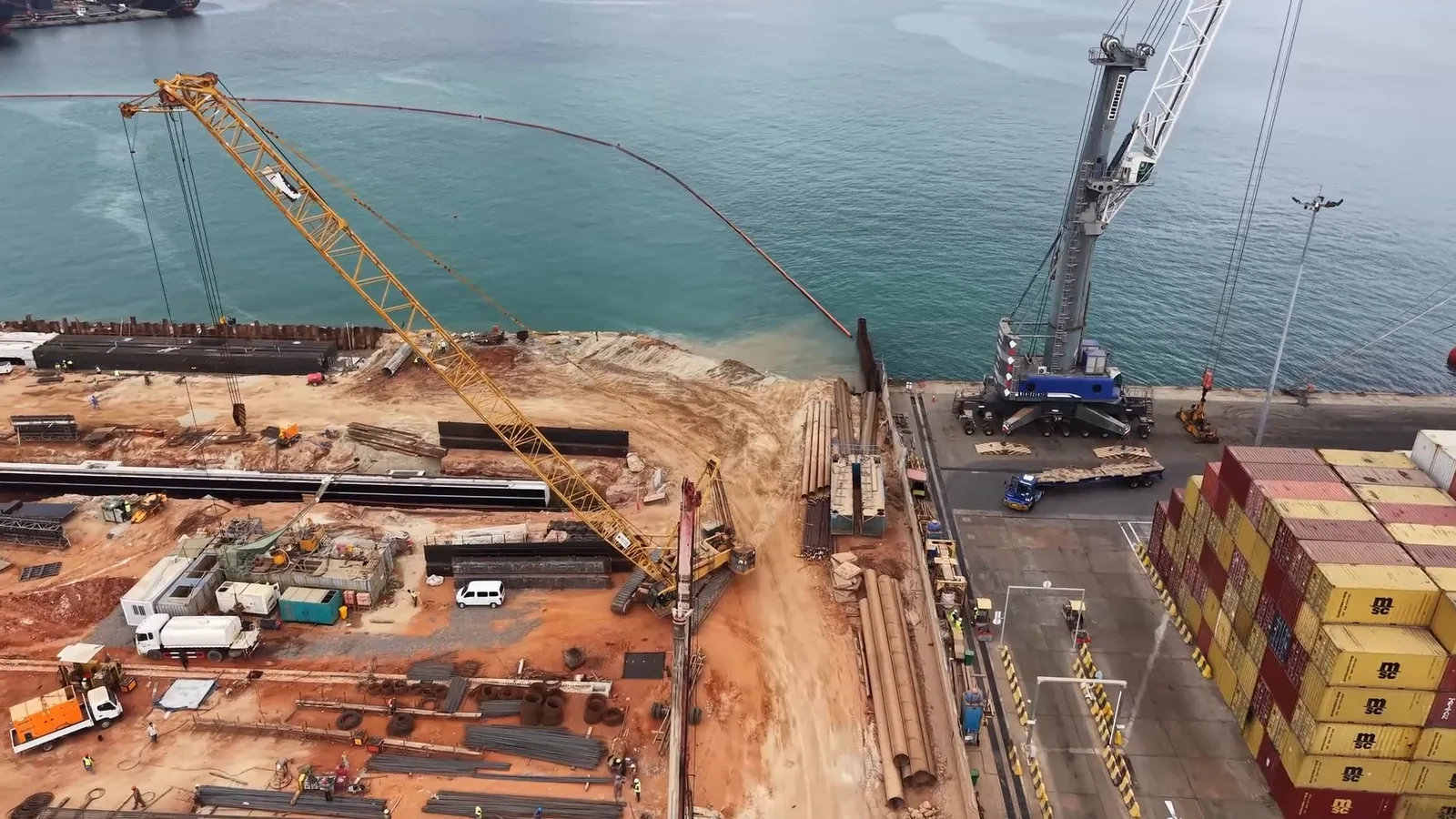 Luanda Marine Works — cranes and steel sections beside the quay