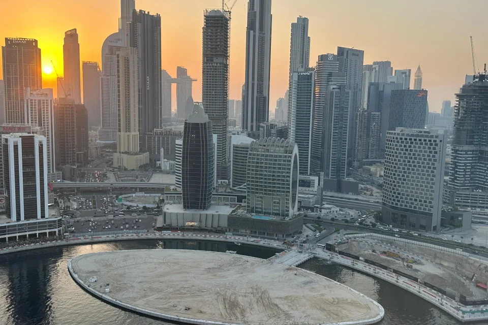 Business Bay Canal Plot 3460738 — reclaimed plot and Dubai skyline at sunset