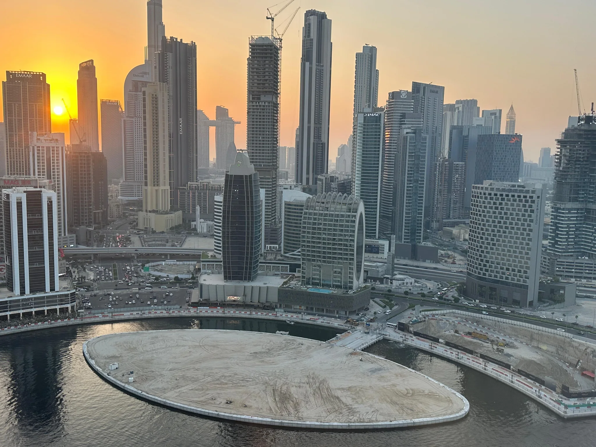 Business Bay Canal Plot 3460738 — reclaimed plot and Dubai skyline at sunset