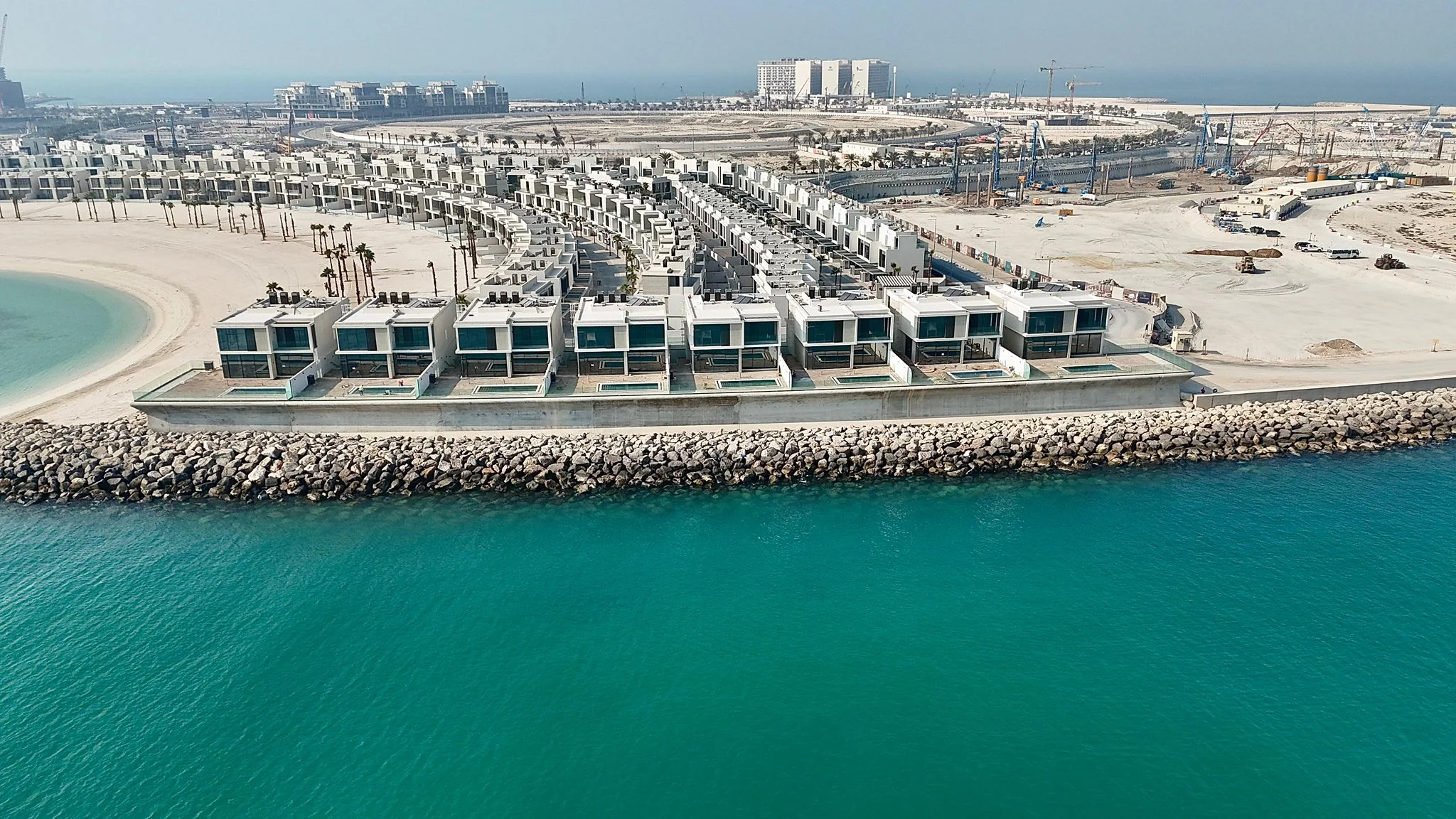 Al Marjan Island — aerial view across the breakwater and beachfront development